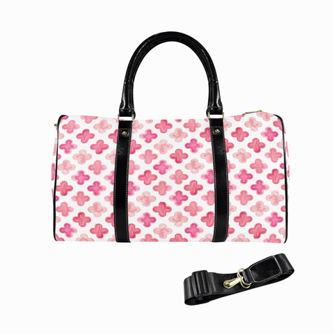 Goldene Handtasche aus floralem Leder