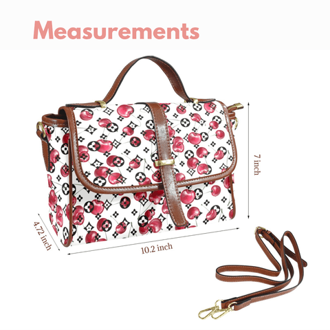 Goldene Handtasche aus floralem Leder