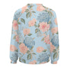 Floral patterned sweatshirt with pink and blue flowers on a light blue background