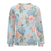 Floral patterned sweatshirt on a light blue background