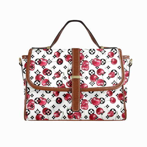 Goldene Handtasche aus floralem Leder