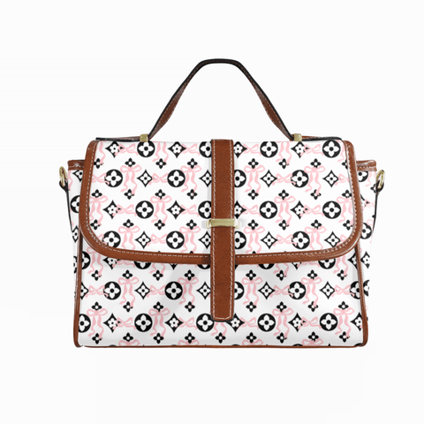 Goldene Handtasche aus floralem Leder