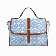 Goldene Handtasche aus floralem Leder
