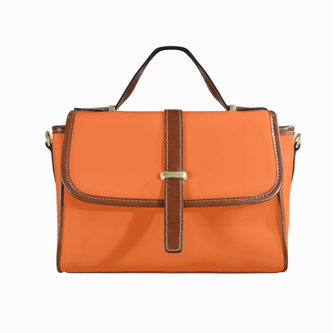 Goldene Handtasche aus floralem Leder